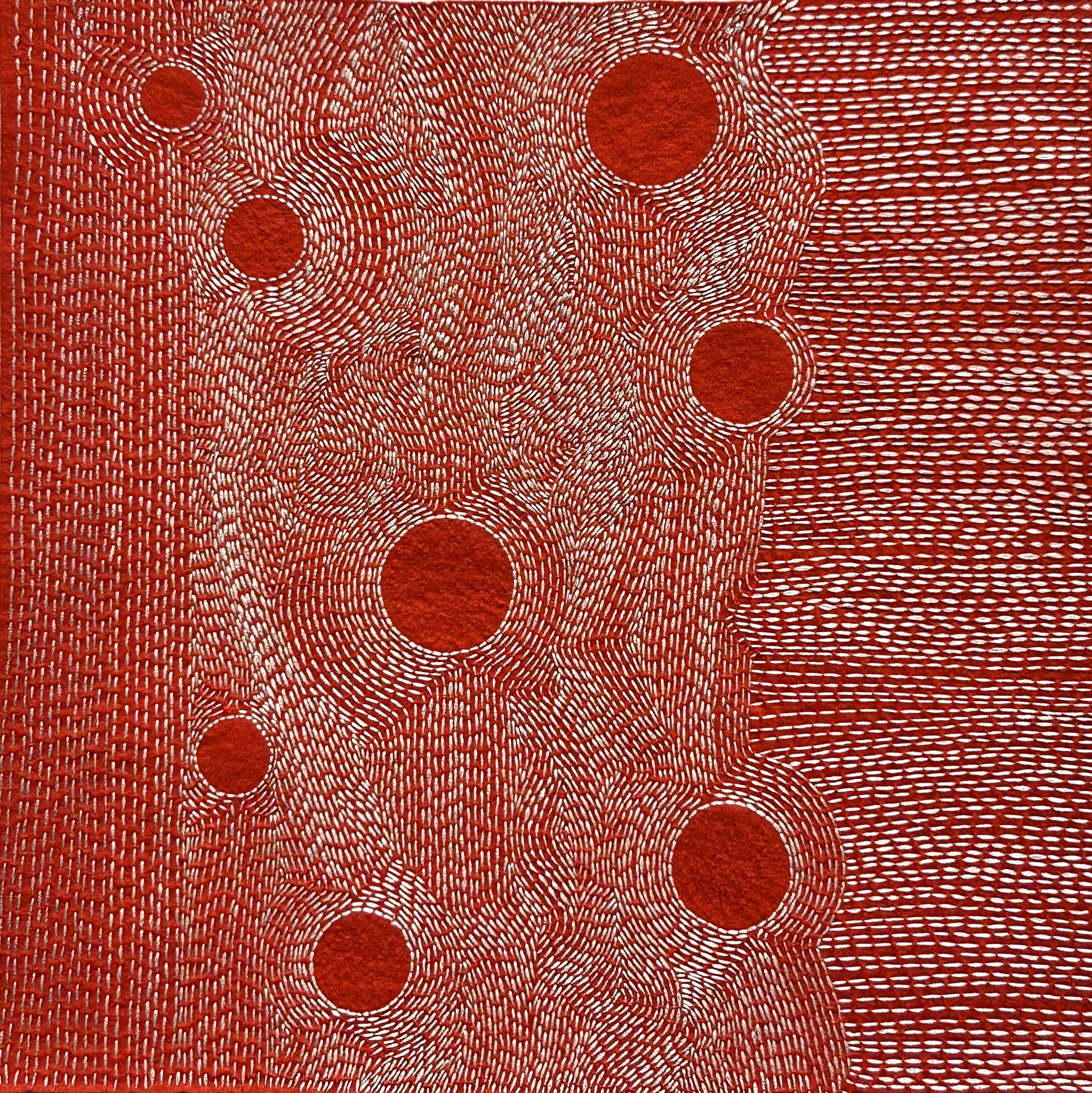 Photo of art off white thread on rust felt