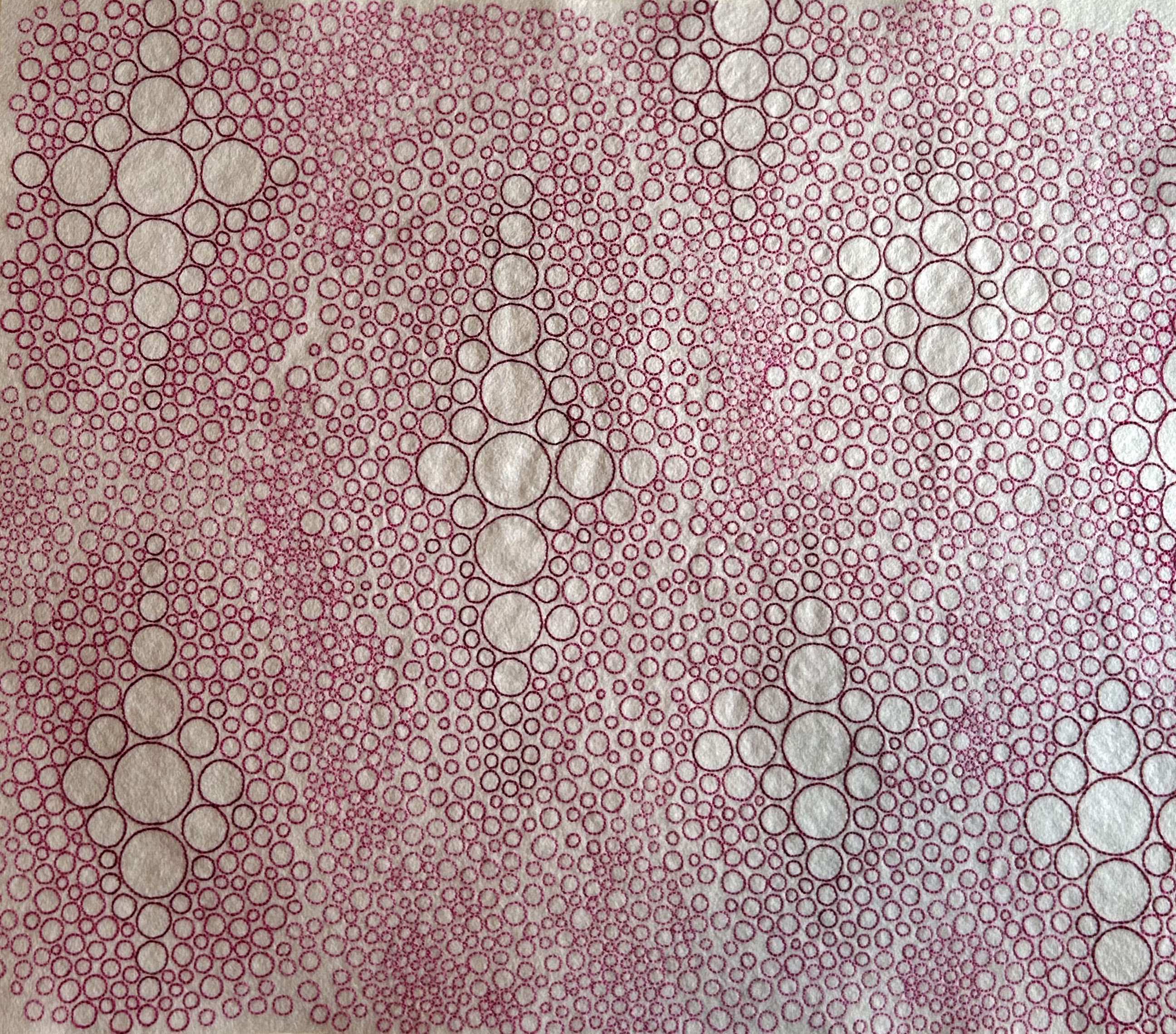 Photo of art plum and Rosewood thread on silver felt